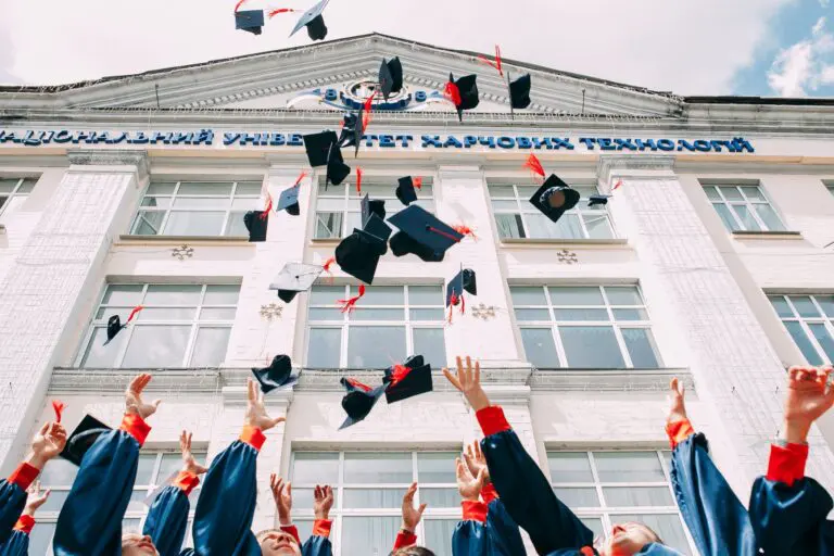 graduation hats being thrown in the air